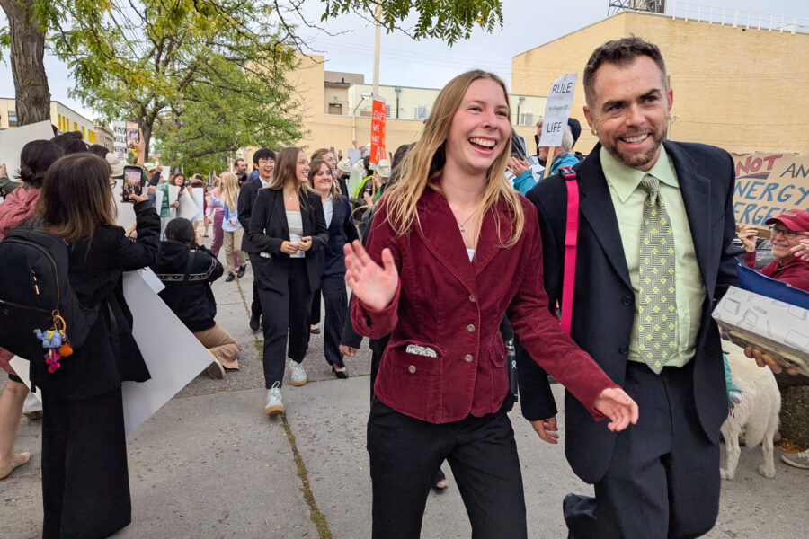 Eva Lighthiser (center), lead plaintiff in the Lighthiser v. Trump case, walks with attorney Mat dos Santos as they arrive at the Russell Smith Courthouse in Missoula, Montana, on Sept. 16. Credit: Issam Ahmed/AFP via Getty Images