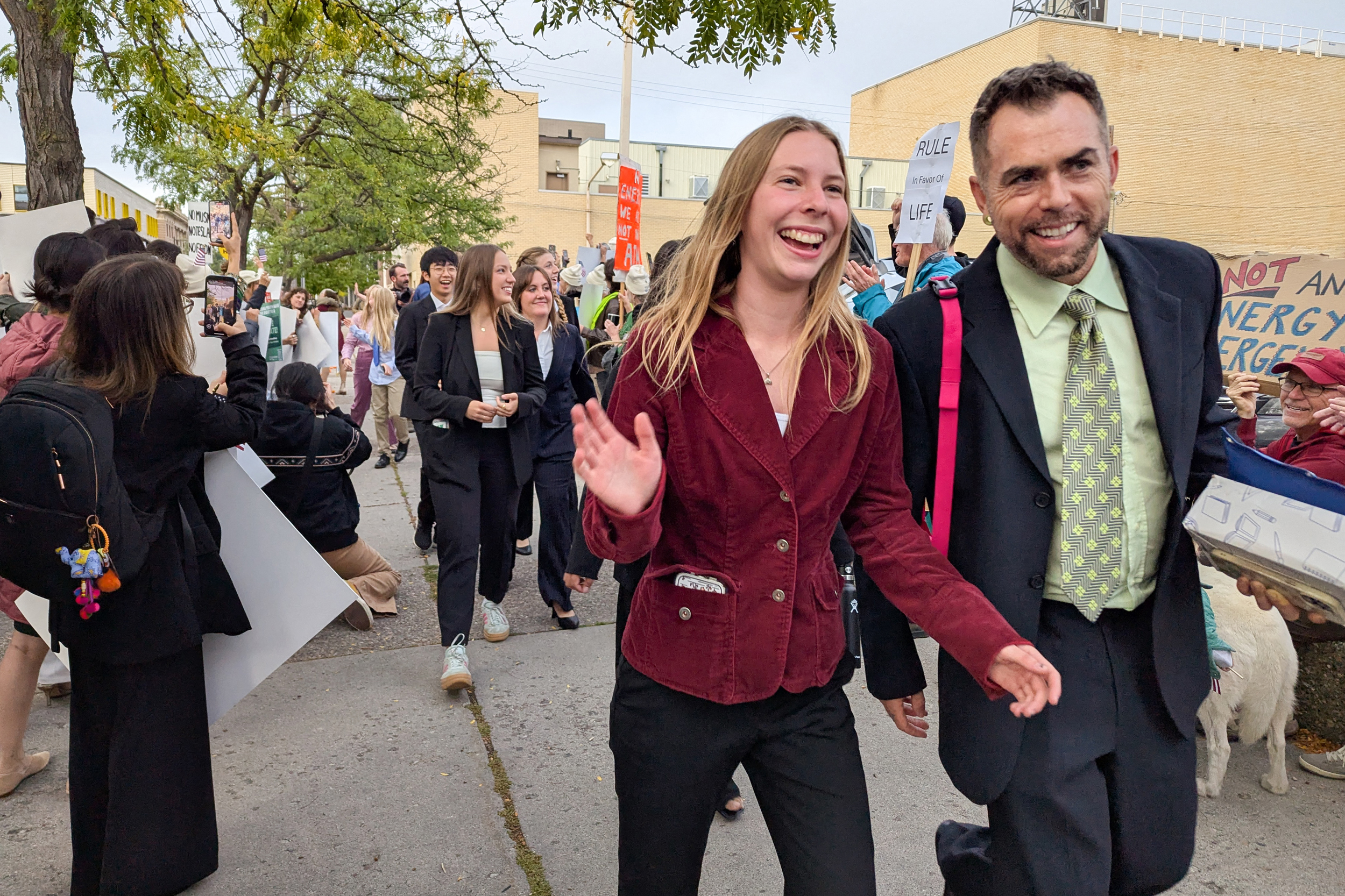 Eva Lighthiser (center), lead plaintiff in the Lighthiser v. Trump case, walks with attorney Mat dos Santos as they arrive at the Russell Smith Courthouse in Missoula, Montana, on Sept. 16. Credit: Issam Ahmed/AFP via Getty Images