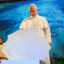 Pope Leo XIV delivers a speech with a chunk of glacial ice during a climate conference on Wednesday in Albano Laziale, Italy. Credit: Simone Risoluti/Vatican Media via Getty Images