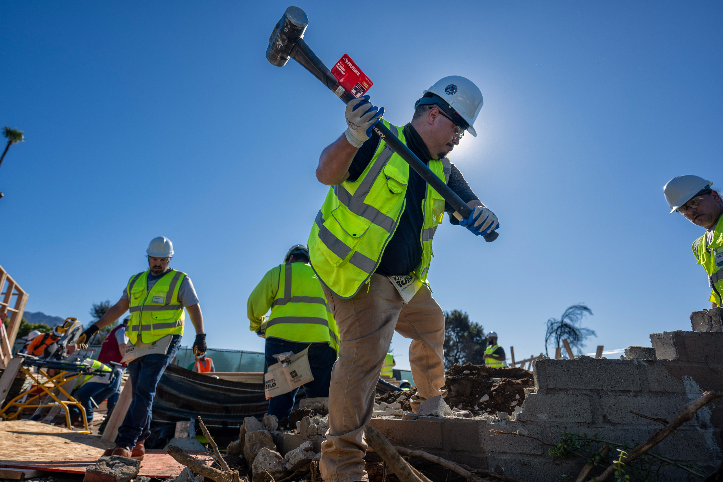 Habitat for Humanity volunteers work to rebuild a home destroyed by the Eaton Fire in Altadena on Oct. 16. Credit: Hans Gutknecht/MediaNews Group/Los Angeles Daily News via Getty Images