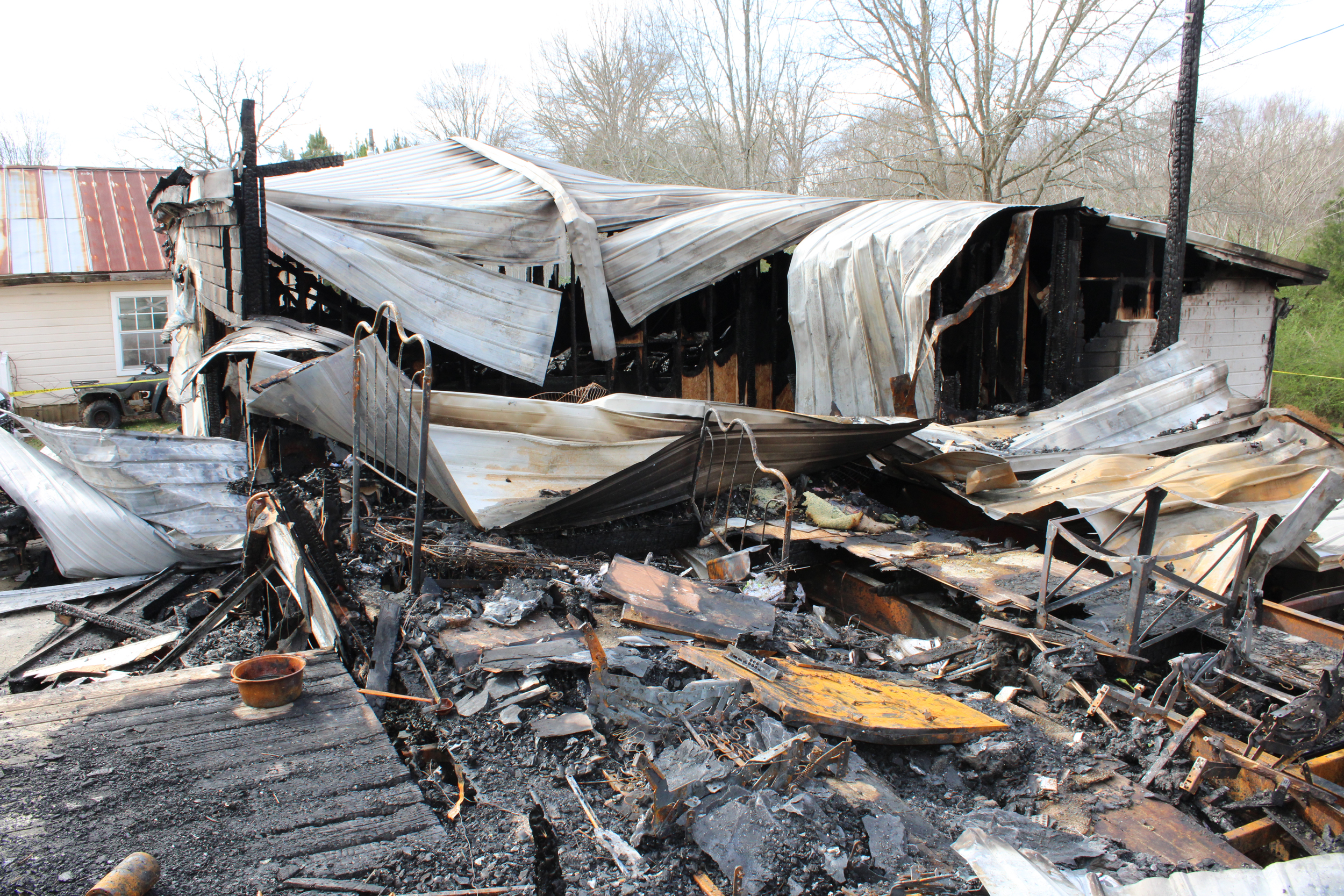 The remnants of a fatal home explosion above the Oak Grove mine in March 2024. Credit: Courtesy of the Alabama Fire Marshal’s Office
