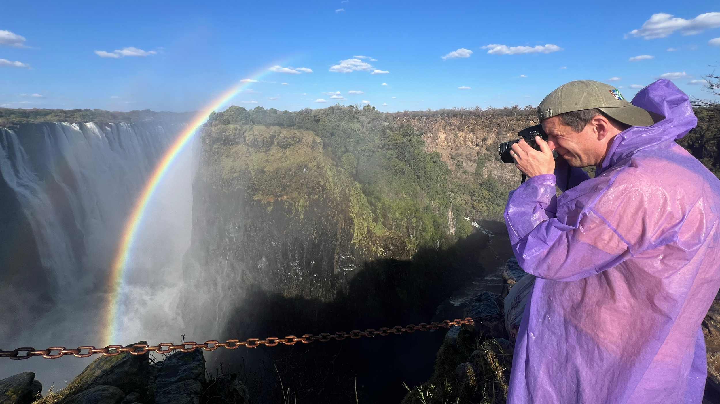 Eco-hydrologist Matthew Simpson takes photographs of Victoria Falls on July 29. Credit: Katie Surma/Inside Climate News