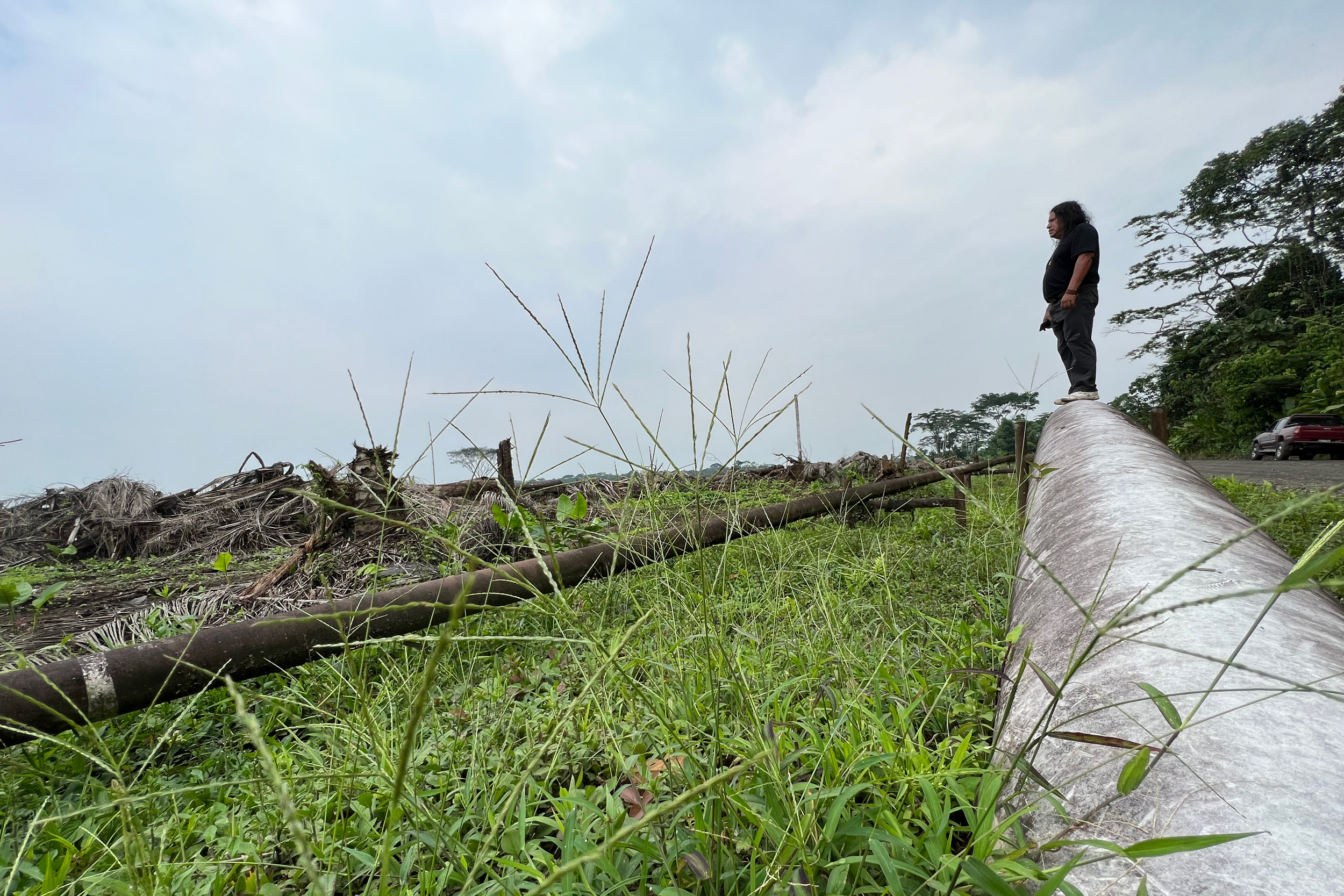 Hector Vargas stands on a pipeline near the Amazonian town of Francisco de Orellana in Ecuador. Credit: Katie Surma/Inside Climate News