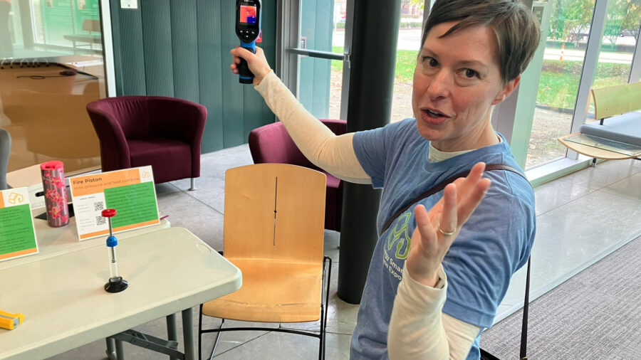 Rachel Kutzley demonstrates a thermal camera, a device that can help to identify the leakage of heat, at the Energy Smart Home Expo in Columbus, Ohio, on Oct. 25. Credit: Dan Gearino/Inside Climate News