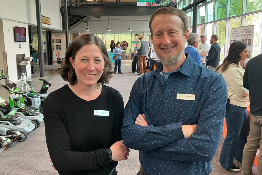 Madeline Fleisher and Andy Leber, co-founders of Electrify Central Ohio, pose for a photo at the expo they helped organize. Credit: Dan Gearino/Inside Climate News