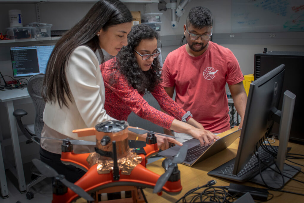 Stephanie Gil, Sushmita Bhattacharya and Ninad Jadhav work in Project CETI's lab. Credit: Stu Rosner/CETI