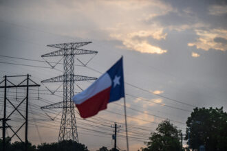 In Houston, a transmission tower in July, as ERCOT, the state's power grid, urged customers to preserve electricity. Credit: Brandon Bell/Getty Images