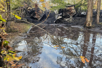 CSX train cars after they derailed last Saturday in New Kent County, Virginia, in wetlands 400 feet from the Chickahimony River. The cars spilled diesel fuel and coal. Credit: The James River Assocation