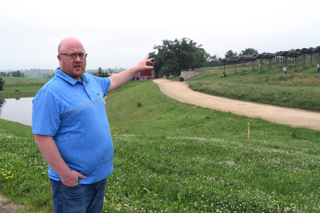 Scott Brabender, with the firm that designed much of Epic’s geothermal system and is overseeing its current buildout, points out a three-tiered borefield completed in 2012. Credit: Phil McKenna/Inside Climate News