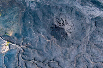 Coal and coke waste is seen piled high at an industrial site in Alabama. Credit: Lee Hedgepeth/Inside Climate News