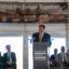 Gov. JB Pritzker speaks at the groundbreaking of the Illinois Quantum and Microelectronics Park on Tuesday in Chicago. Credit: Keerti Gopal/Inside Climate News