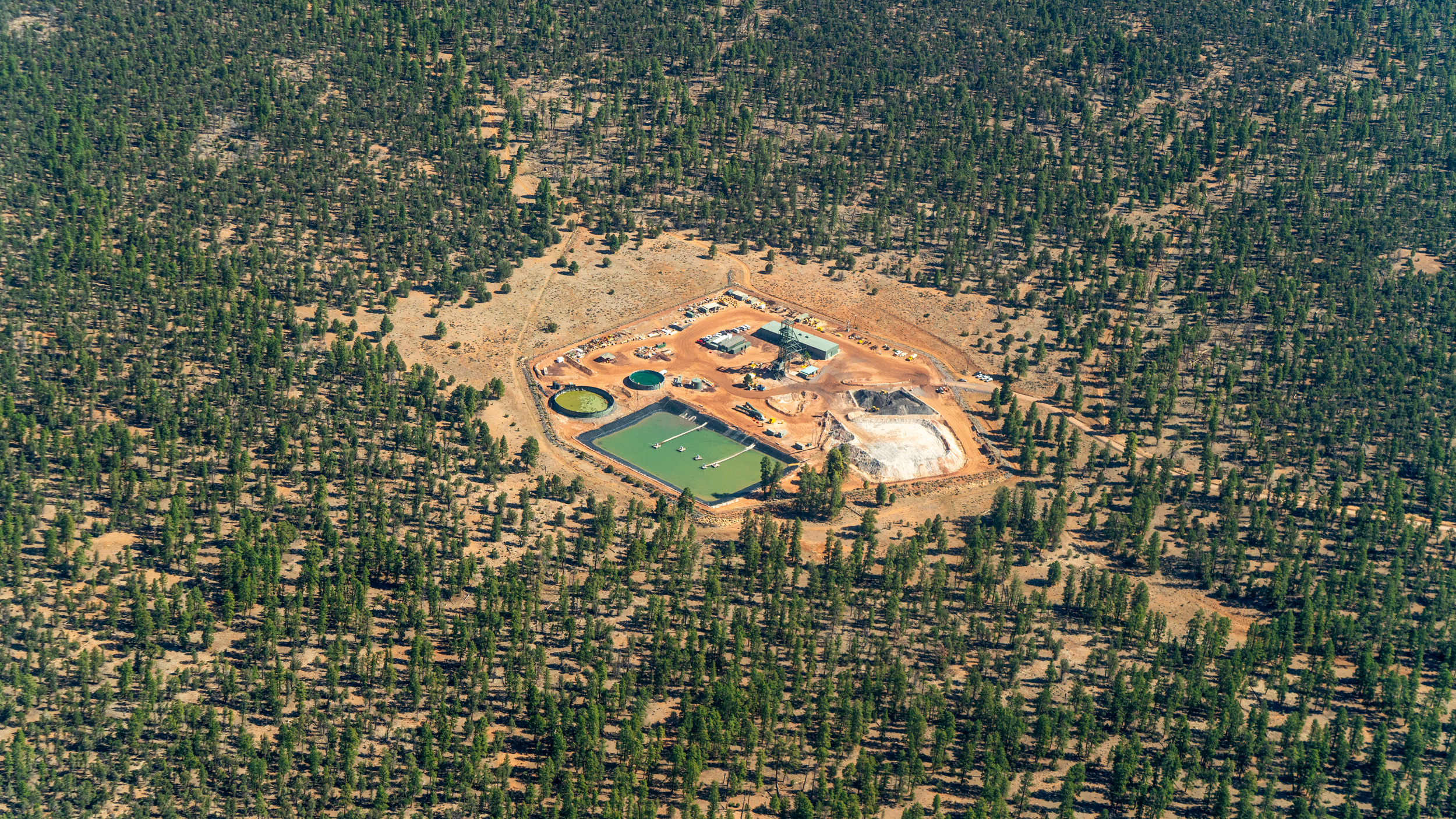 Less than 20 miles from the Grand Canyon’s south rim and located within Arizona’s Baaj Nwaavjo I'tah Kukveni National Monument, is Energy Fuels’ Pinyon Plain Mine. Local tribes, environmentalists and researchers fear the mine will contaminate the Grand Canyon’s regional aquifers. Credit: EcoFlight