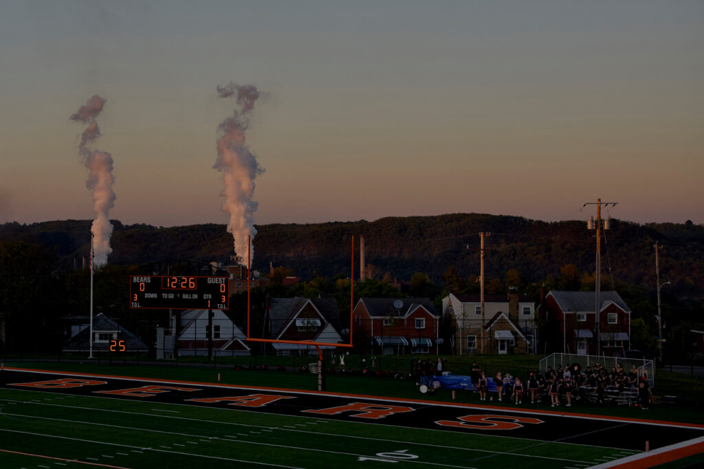 A haze hangs in the air as the Clairton High School homecoming football game is played a few miles from the coke plant.