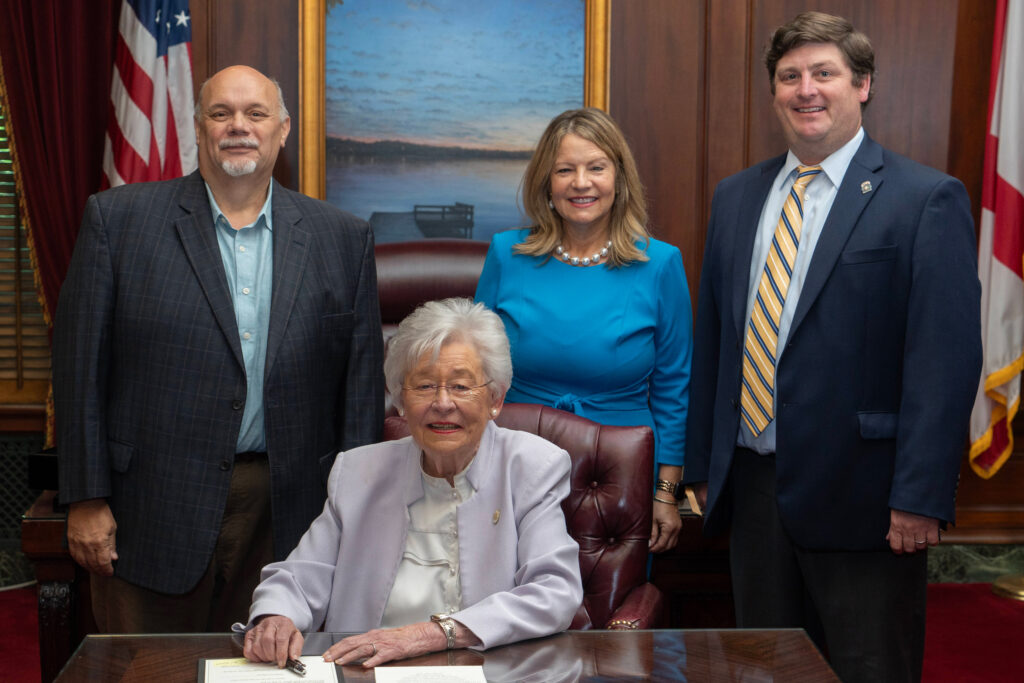 Cynthia Almond poses with her fellow commissioner and Gov. Kay Ivey following her swearing in. Credit: courtesy of Alabama Governor’s Office