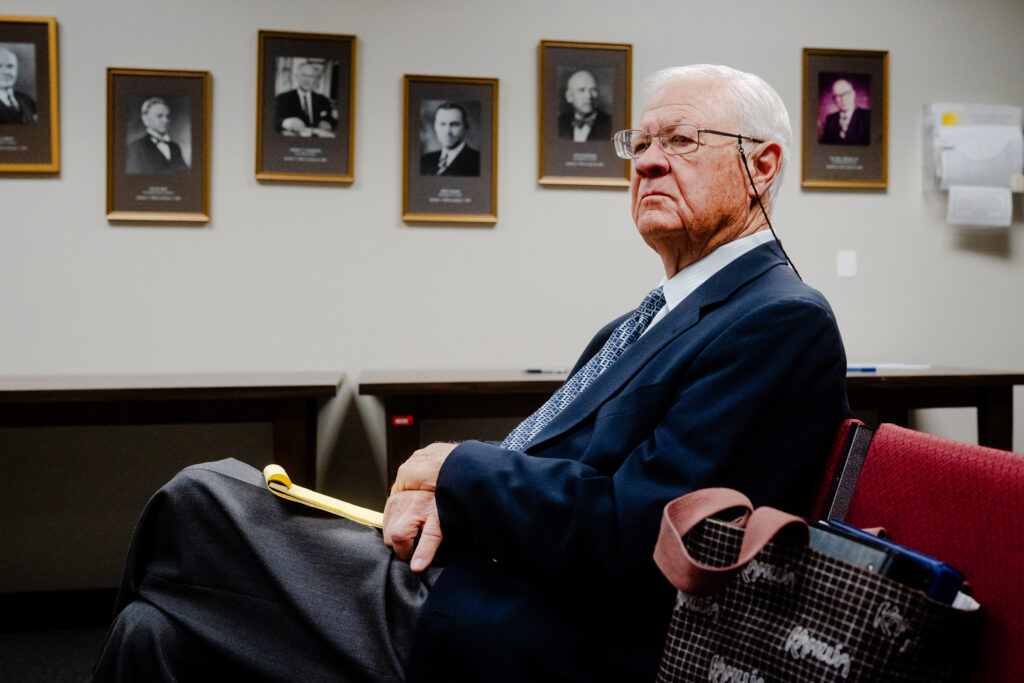 Jerry Cargill, a Waskom resident who has spearheaded the research and opposition to a waste pit operated by McBride, sits in a hearing of the Railroad Commission of Texas in the William B. Travis State Office Building in Austin on July 31. Credit: Brenda Bazán