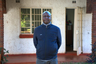 Tawanda Majoni, an investigative journalist and founder of Information for Development Trust, stands outside his office in Harare, Zimbabwe. Credit: Katie Surma/Inside Climate News