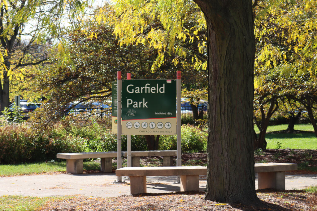A sign at Garfield Park marks its history and highlights the activities available—part of a familiar sight across Chicago’s parks. Credit: Yiannis Mastoras/Inside Climate News