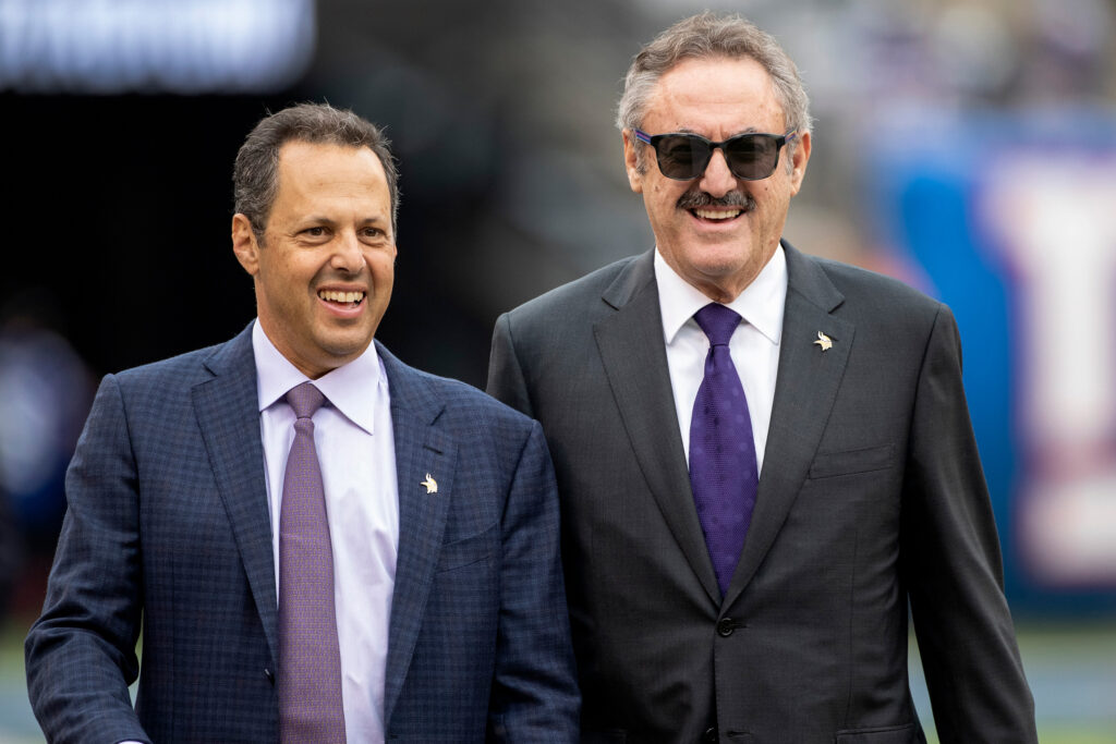 Zygi Wilf (right) and his brother, Mark Wilf, walk on the sidelines for pregame warm-ups between the Minnesota Vikings and New York Giants at MetLife Stadium in East Rutherford, N.J. Credit: Carlos Gonzalez/Star Tribune via Getty Images