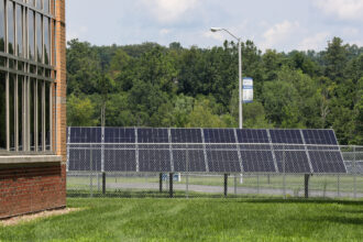 Solar panels are seen on the campus of Central Columbia High School in Bloomsburg, Pa., as part of a combination ground-mount and rooftop 3.8 megawatt array. Credit: Paul Weaver/SOPA Images/LightRocket via Getty Images