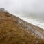 A nor’easter causes large waves to hit a bluff filled with sand to prevent erosion in Nantucket, Mass., on Feb. 13, 2024. Credit: Stan Grossfeld/The Boston Globe via Getty Images