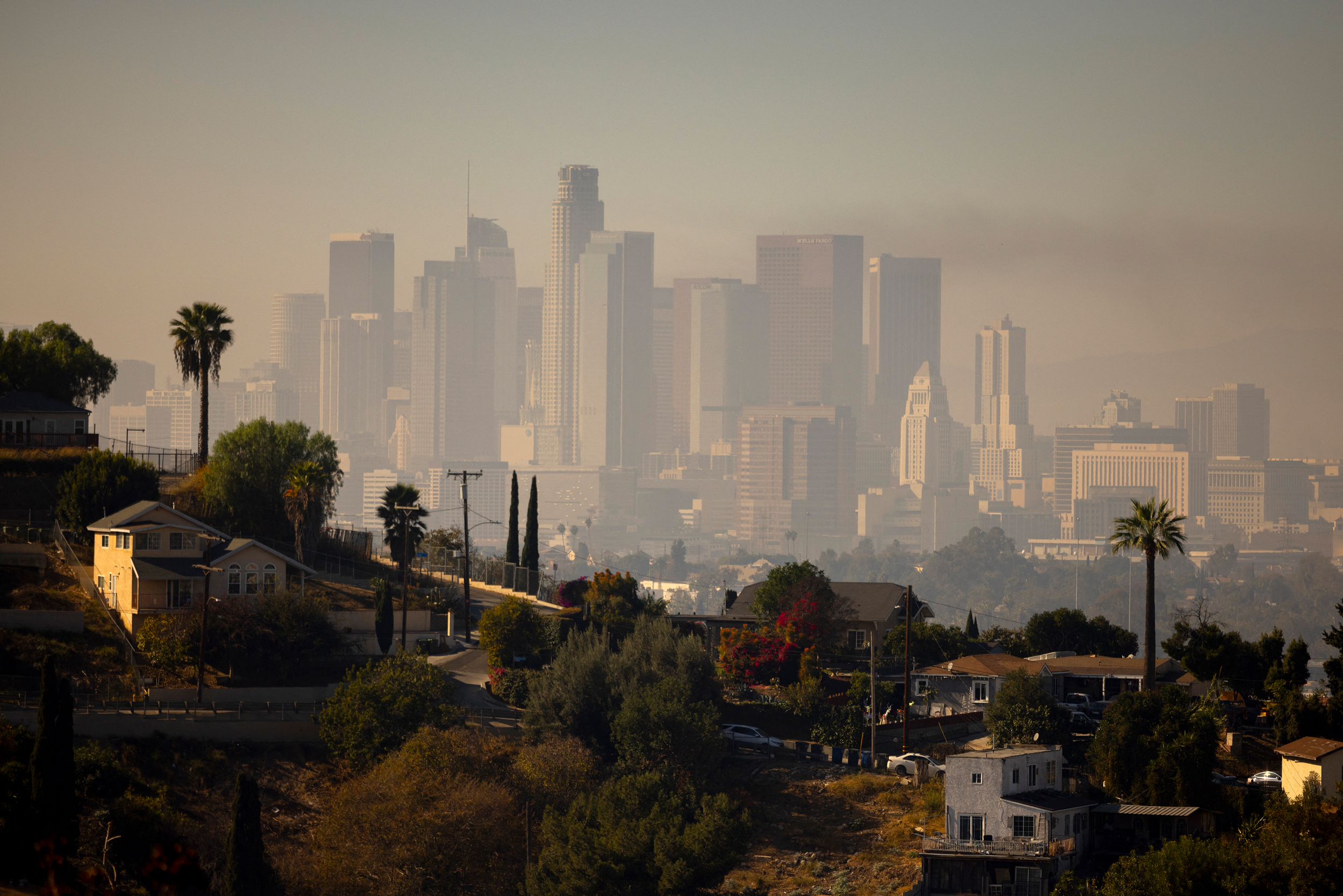 A layer of smog lingers above the downtown Los Angeles skyline on Dec. 6, 2024, as the region faces an air quality alert issued by the National Weather Service. Credit: Etienne Laurent/AFP via Getty Images
