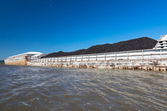 A barge transporting coal moves along the Illinois River near Peoria, Ill. Credit: Jim West/UCG/Universal Images Group via Getty Images