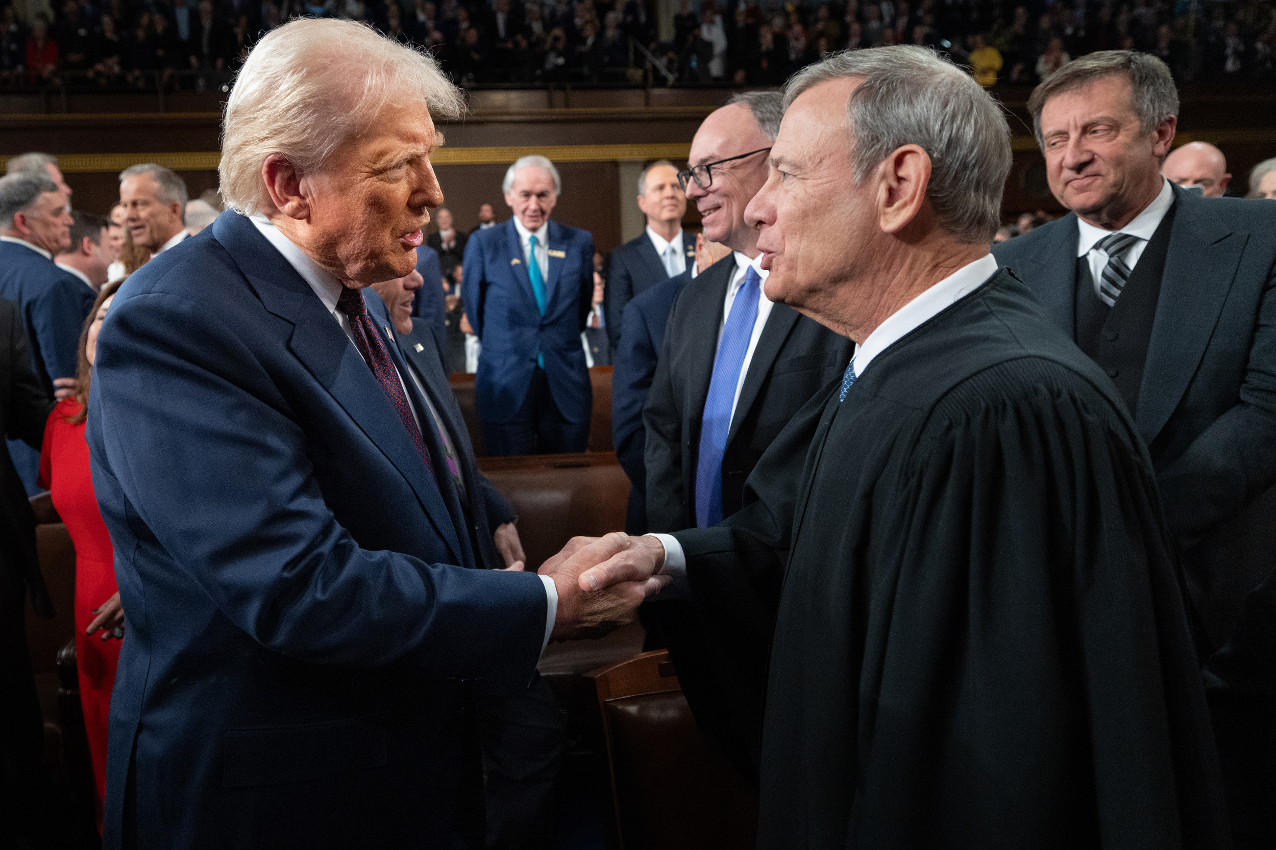 President Donald Trump greets Supreme Court Chief Justice John Roberts as he arrives to deliver an address to a joint session of Congress on March 4. Credit: Win McNamee/Getty Images