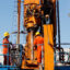 Workers assemble a drill rod on a geothermal drilling rig in Krefeld, Germany. Credit: Roland Weihrauch/picture alliance via Getty Images