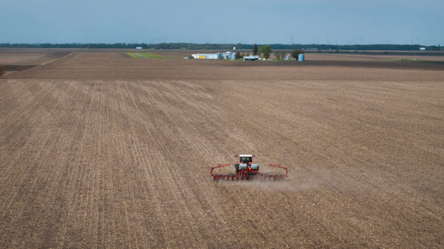 A farmer uses a tractor to plant soybeans on land near Dwight, Ill., on April 28. Credit: Scott Olson/Getty Images