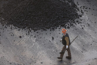 A steelworker works in the coal field at U.S. Steel’s Clairton Coke Works in Pennsylvania on Dec. 17, 2024. Credit: Quinn Glabicki/The Washington Post via Getty Images