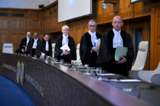 Members of the International Court of Justice arrive to issue an advisory opinion on states’ legal obligations to address climate change in The Hague on July 23. Credit: John Thys/AFP via Getty Images