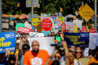 Climate activists march across the Brooklyn Bridge on Aug. 9 to demand that New York Gov. Kathy Hochul stop the construction of the Williams Northeast Supply Enhancement pipeline. Credit: Michael Nigro/Pacific Press/LightRocket via Getty Images