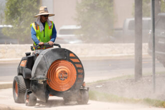 A worker stripes an intersection on a hot afternoon in Austin, Texas, on Aug. 6. Credit: Jay Janner/Austin American-Statesman via Getty Images