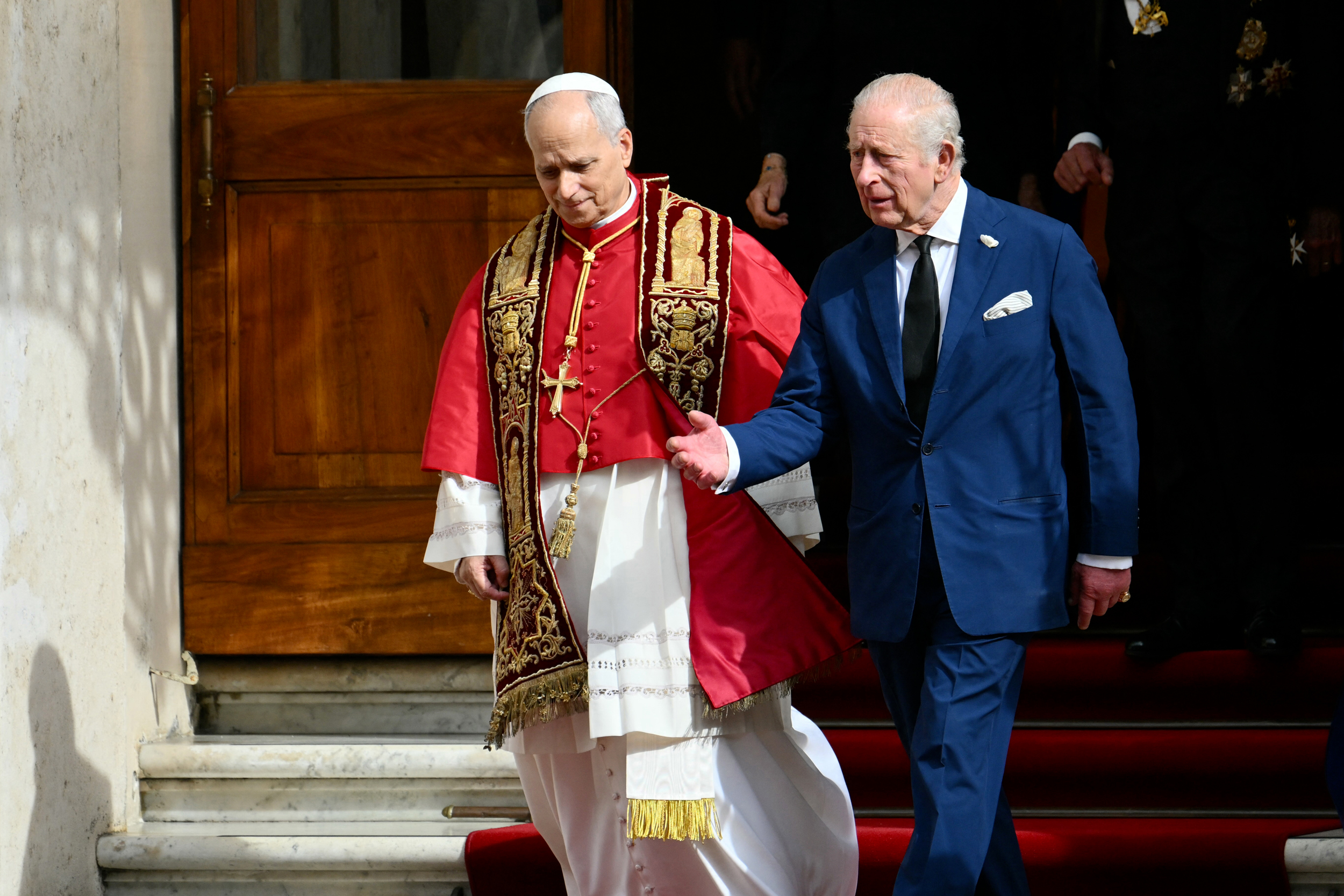 Pope Leo XIV bids farewell to King Charles III in the San Damaso courtyard during his visit to the Vatican on Oct. 23. Credit: Alberto Pizzoli/AFP via Getty Images