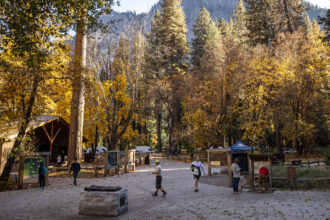 Visitors walk around the welcome center at Yosemite National Park in California on Oct. 30. Credit: Stephen Lam/San Francisco Chronicle via Getty Images