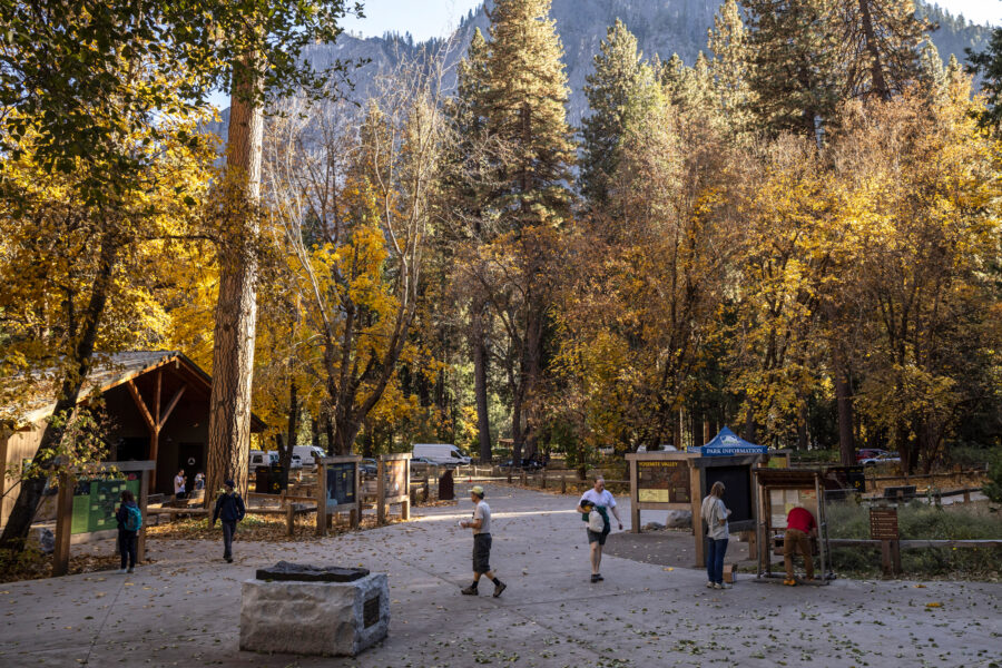 Visitors walk around the welcome center at Yosemite National Park in California on Oct. 30. Credit: Stephen Lam/San Francisco Chronicle via Getty Images