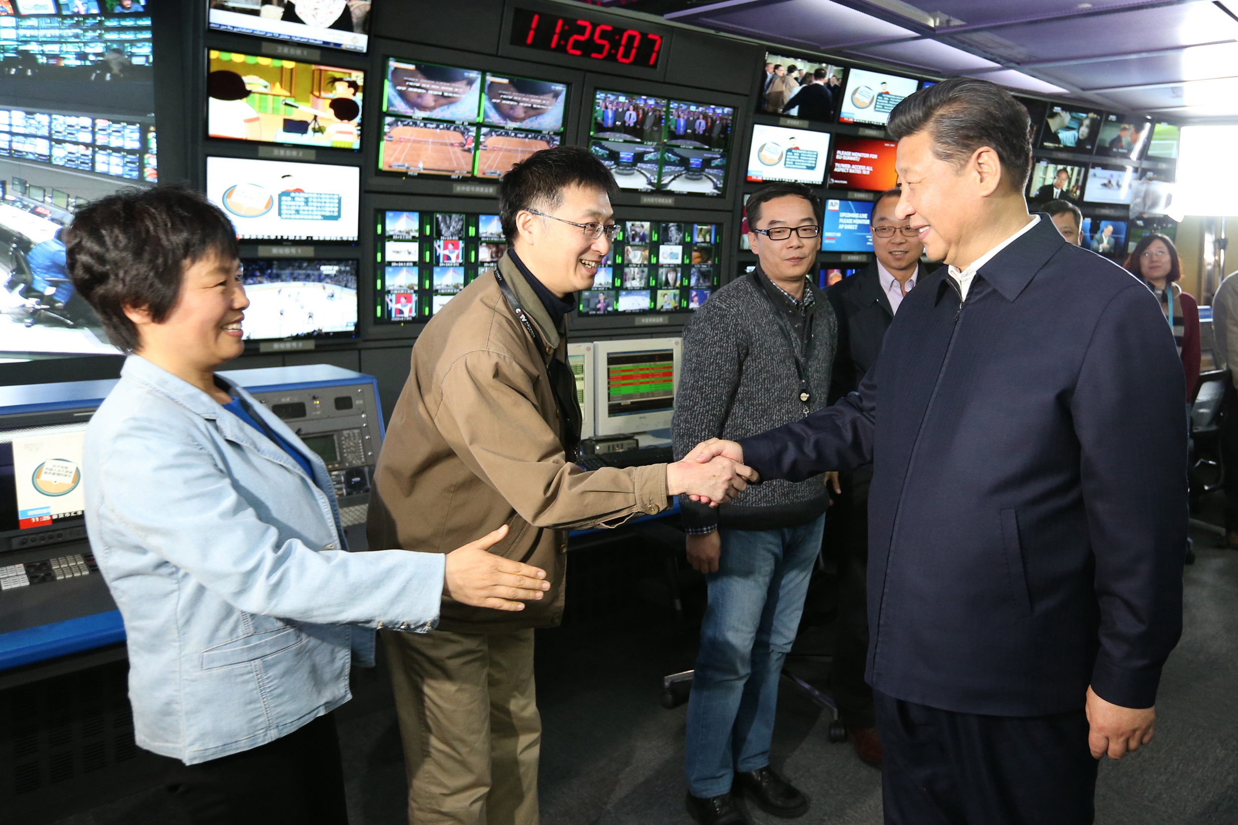 President Xi Jinping (right) meets with staff members at the control room of China Central Television during a visit to news agencies in Beijing on Feb. 19, 2016. Credit: Xinhua/Ma Zhancheng via Getty Images