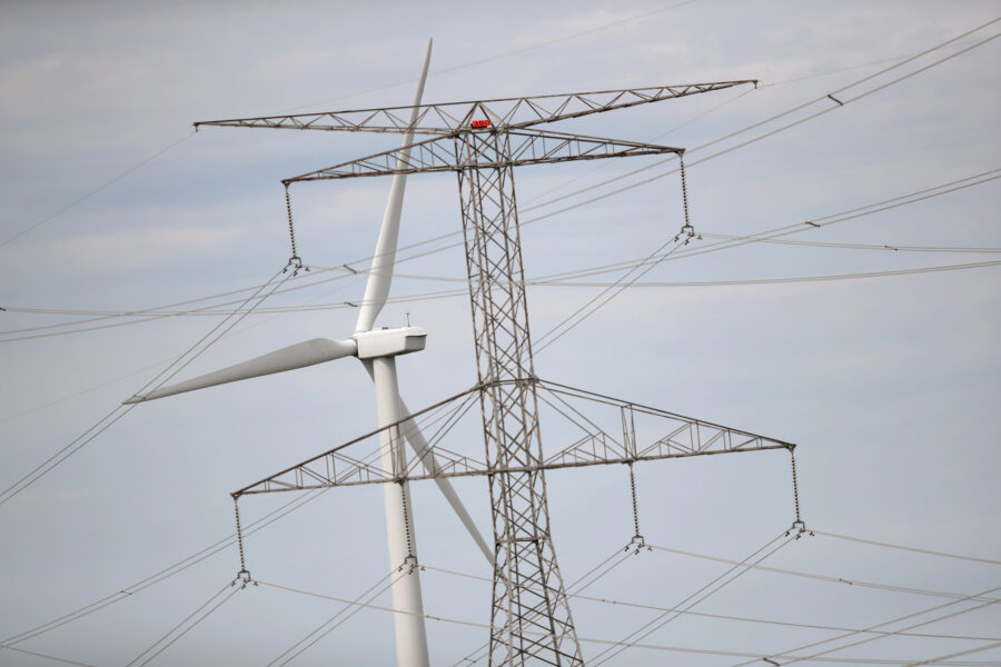 Power lines and a wind turbine rise above the rural landscape of Dwight, Ill. Credit: Scott Olson/Getty Images