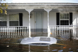 In Lumberton, North Carolina, a car floats in front of a flooded home in September 2018 in the aftermath of Hurricane Florence. Credit: Eamon Queeney/For The Washington Post via Getty Images