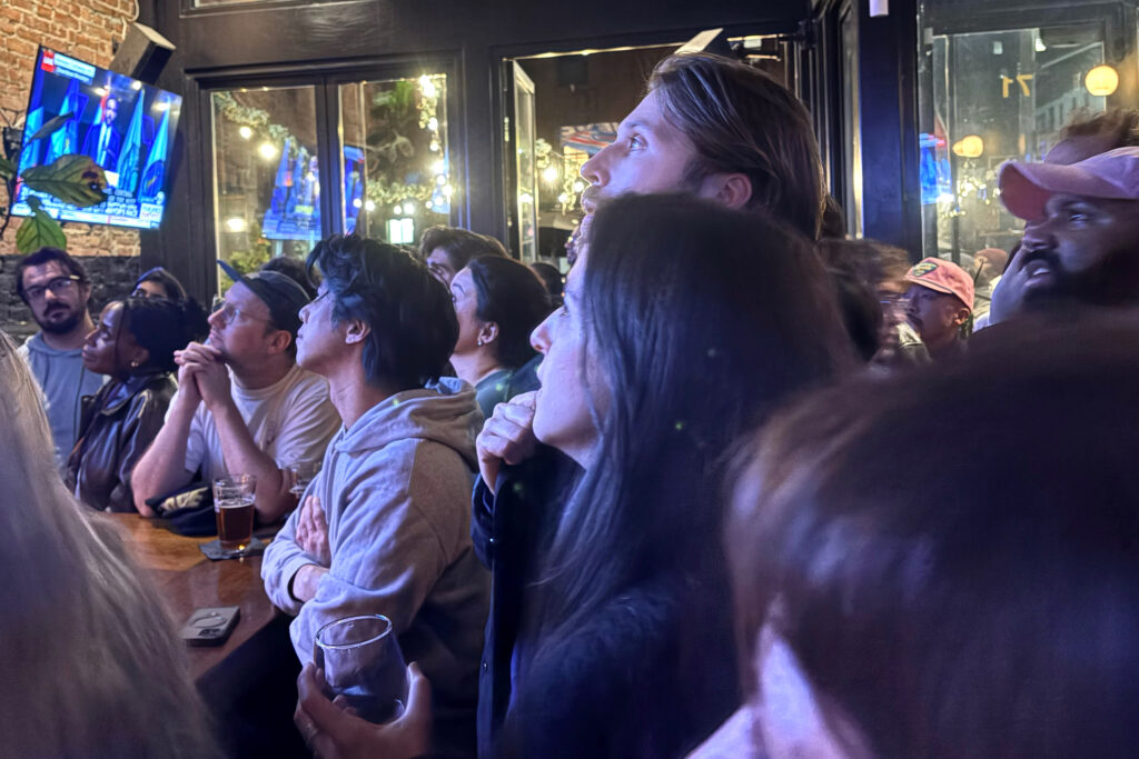 Zohran Mamdani supporters gather at a Brooklyn bar Tuesday night to watch his victory speech. Credit: Lauren Dalban/Inside Climate News