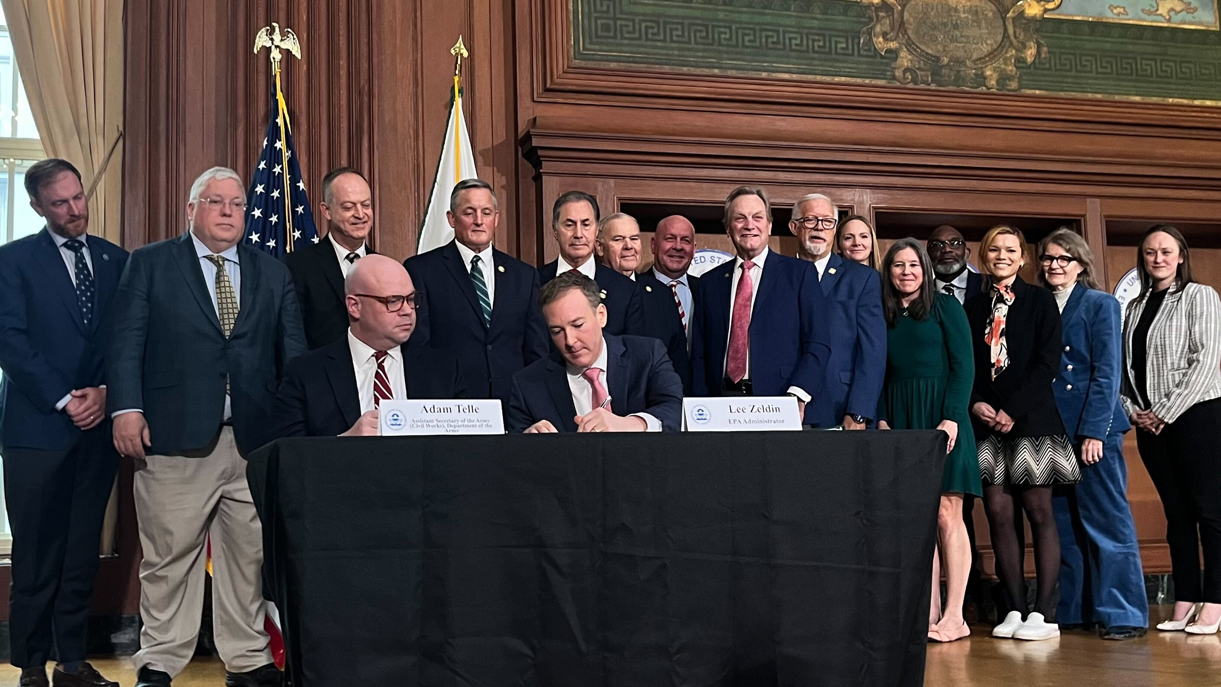 EPA Administrator Lee Zeldin (center) signs a proposed rule in Washington, D.C., on Monday that would revise the definition of “waters of the United States,” scaling back which bodies of water are subject to federal protections. Credit: Aidan Hughes/Inside Climate News