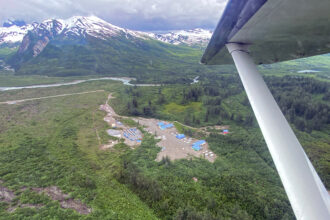 The Johnson Tract is a private parcel with a worker camp and airstrip, surrounded by the vast Lake Clark National Park in Alaska. Credit: Max Graham/Northern Journal