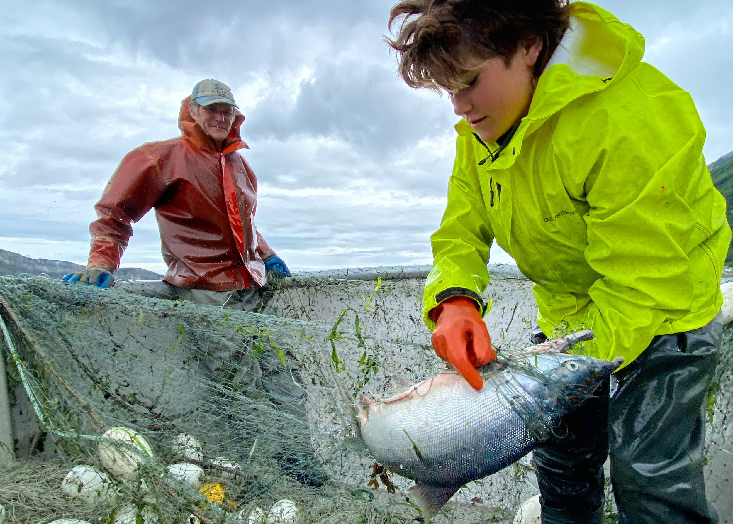 Dustin Solberg and his son, Leif, catch salmon in the Tuxedni Channel. Credit: Max Graham/Northern Journal