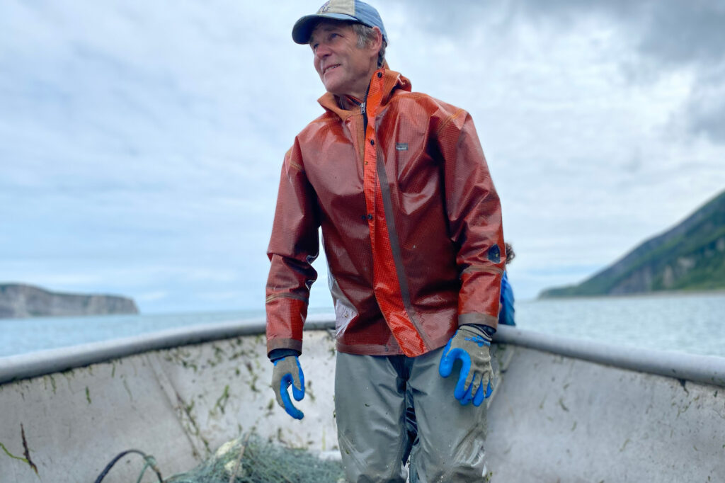 Dustin Solberg, a commercial fisherman, stands at the bow of his skiff in the middle of Tuxedni Channel. Credit: Max Graham/Northern Journal