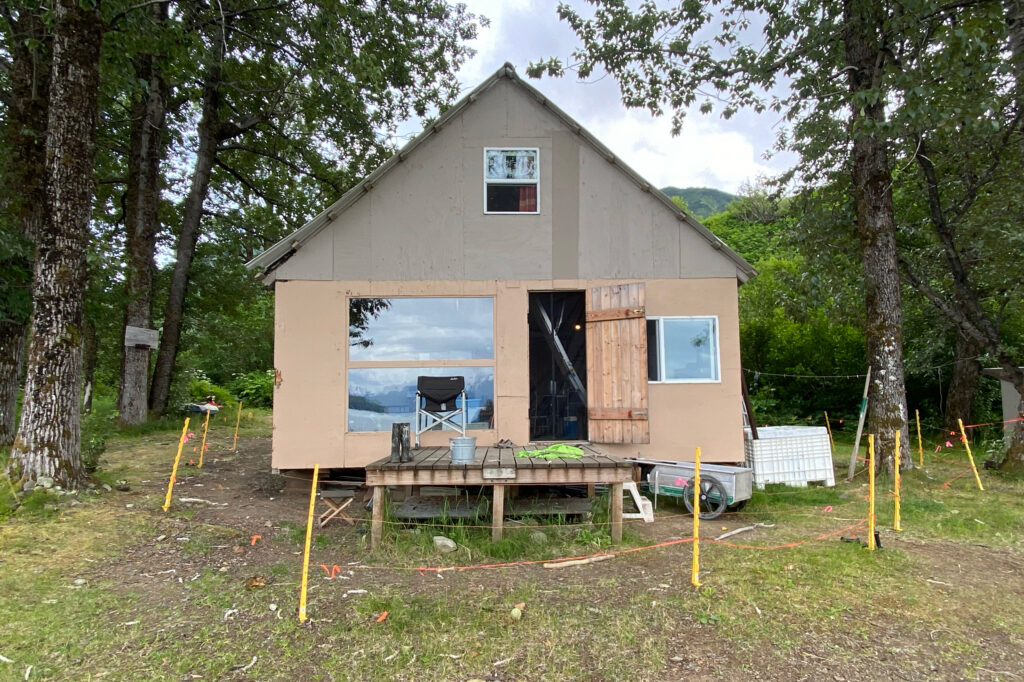 A cabin used by fisherman Dustin Solberg and his family stands in Lake Clark National Park, near the shore of Tuxedni Bay. Credit: Max Graham/Northern Journal