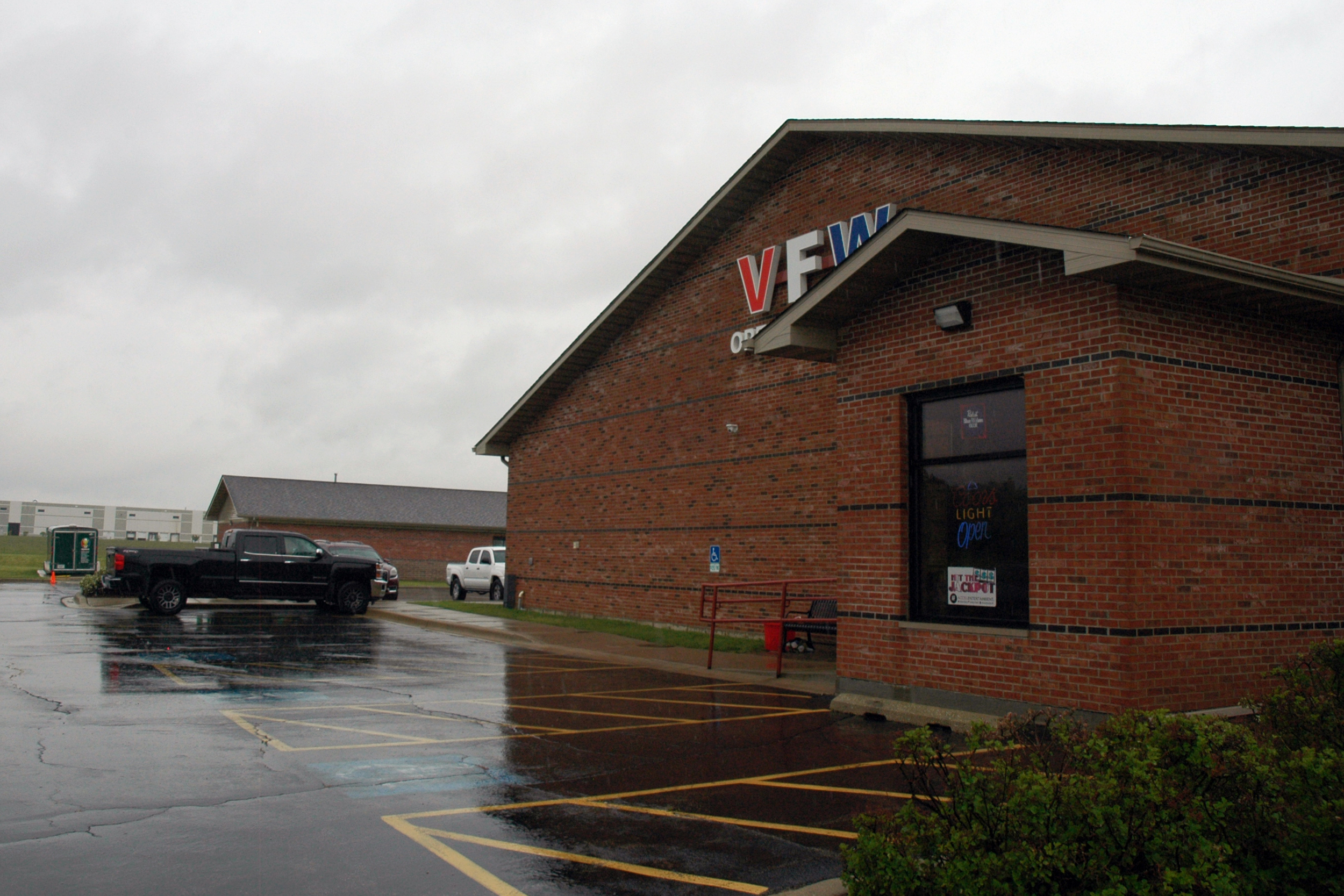 A warehouse sits just behind a Veterans of Foreign Wars building in Will County, Ill., near a gas and service station for trucks. Credit: Siri Chilukuri/Inside Climate News