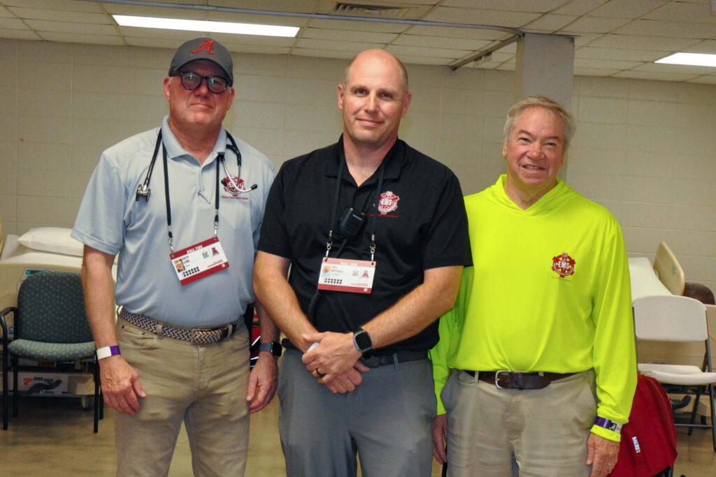 From left: Rusty Lowe, Wes Michaels and Glenn Davis are the leaders of EMS operations at Bryant-Denny Stadium. Credit: Olivia McMurrey/Inside Climate News