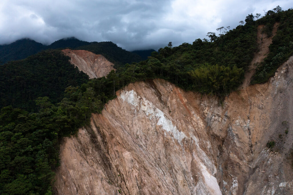 Landslides expose bedrock in the mountains surrounding Mocoa.
