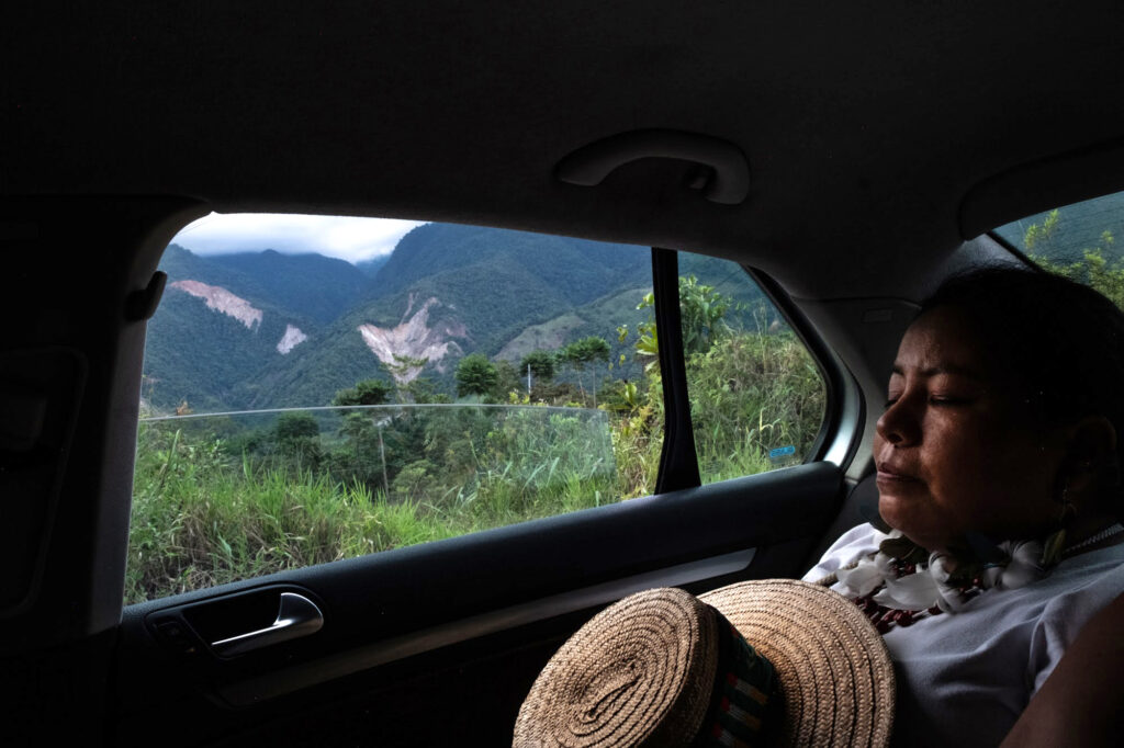 Zuly Rivera passes by landslides in the mountains surrounding Mocoa.