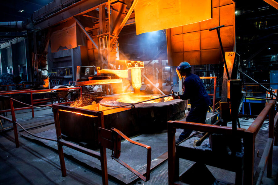 An employee works on the floor of the Metal Technologies plant in Ravenna, Mich. The company participates in a demand response program in which its industrial facilities agree to power down at times of high demand on the grid. Credit: Metal Technologies